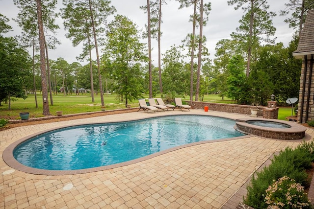 view of swimming pool featuring a patio area and an in ground hot tub