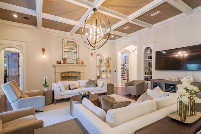 living room featuring hardwood / wood-style floors, wooden ceiling, coffered ceiling, beamed ceiling, and a notable chandelier