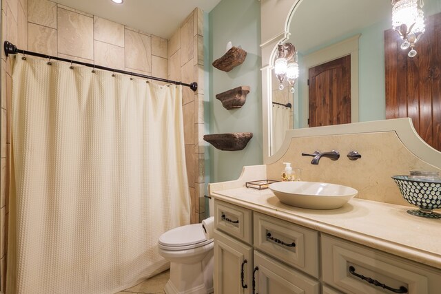 bathroom with vanity, curtained shower, and toilet