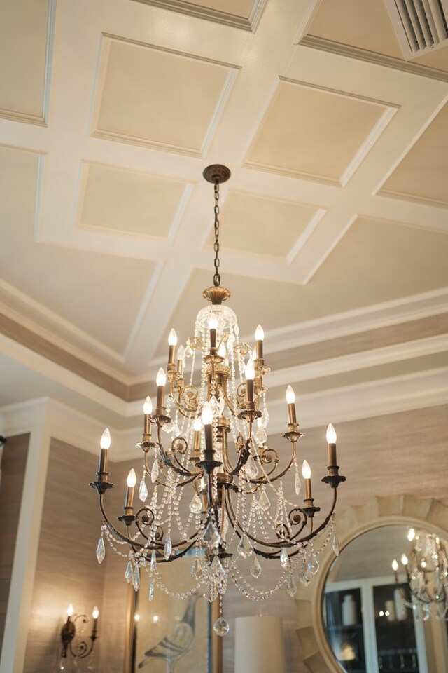 interior details featuring an inviting chandelier