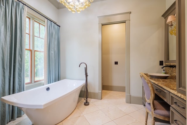 bathroom featuring vanity, crown molding, a bath, and a chandelier