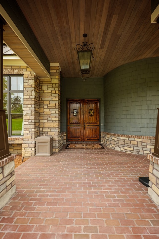 doorway to property featuring covered porch