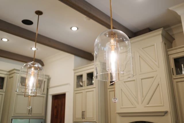 details with beam ceiling and ornamental molding