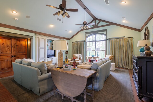 living room featuring vaulted ceiling with beams, dark hardwood / wood-style floors, and ceiling fan