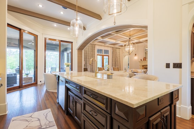 kitchen with plenty of natural light, sink, and dark wood-type flooring