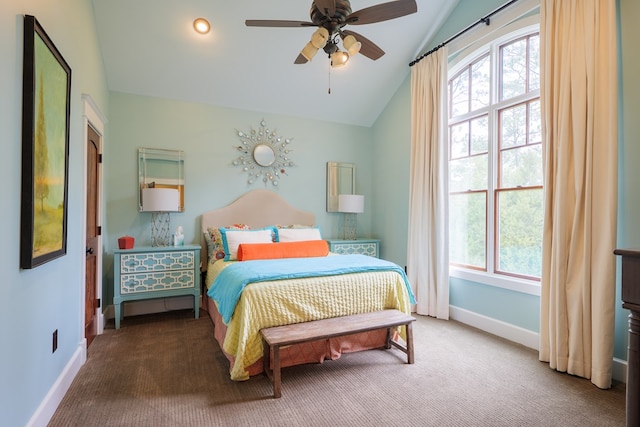 bedroom with carpet flooring, multiple windows, ceiling fan, and lofted ceiling