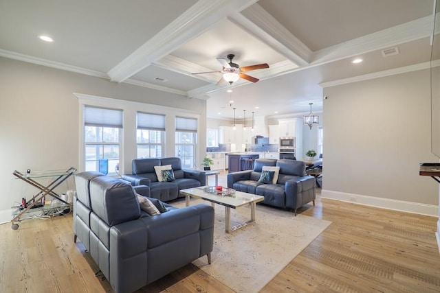 living room featuring coffered ceiling, ceiling fan with notable chandelier, crown molding, light hardwood / wood-style flooring, and beam ceiling