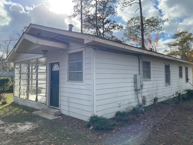 view of home's exterior featuring a sunroom