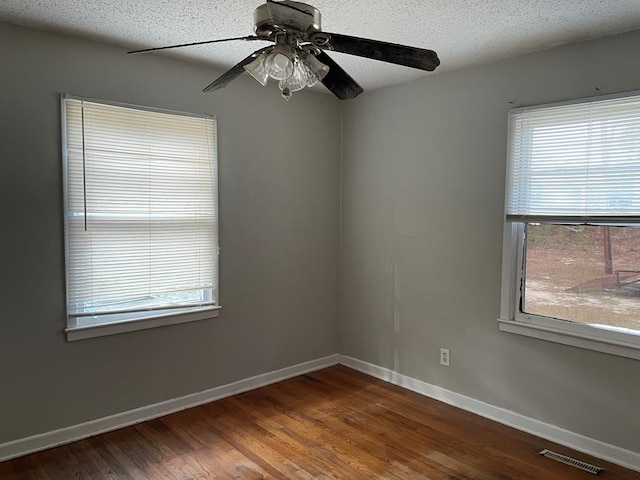 unfurnished room with wood-type flooring, a textured ceiling, and ceiling fan