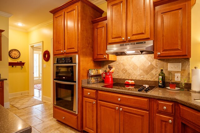 kitchen featuring sink, light tile patterned floors, and a center island