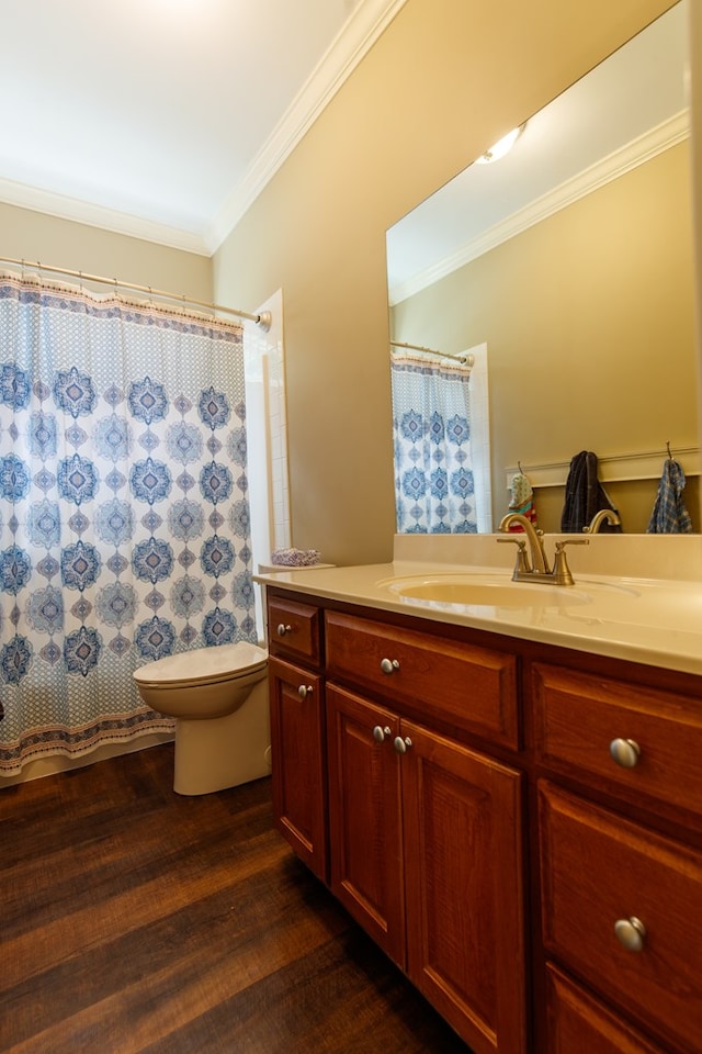 full bath with vanity, toilet, ornamental molding, curtained shower, and wood finished floors