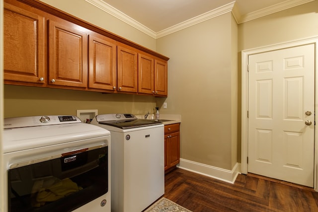 laundry room featuring cabinets, crown molding, separate washer and dryer, and dark wood-type flooring