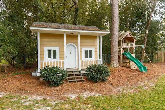 exterior space with fence and a playground