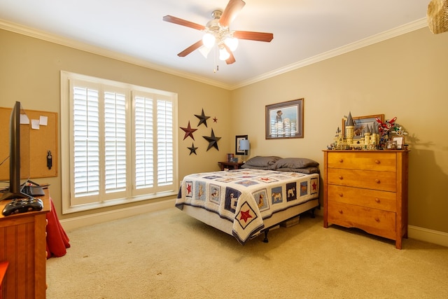 carpeted bedroom featuring crown molding and ceiling fan