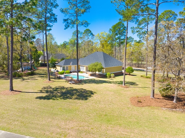 view of yard with an outdoor pool