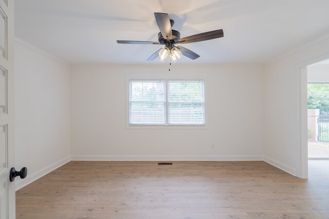 unfurnished room with crown molding, ceiling fan, and light wood-type flooring