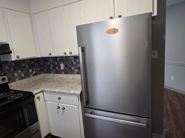 kitchen featuring backsplash, exhaust hood, white cabinets, and stainless steel appliances