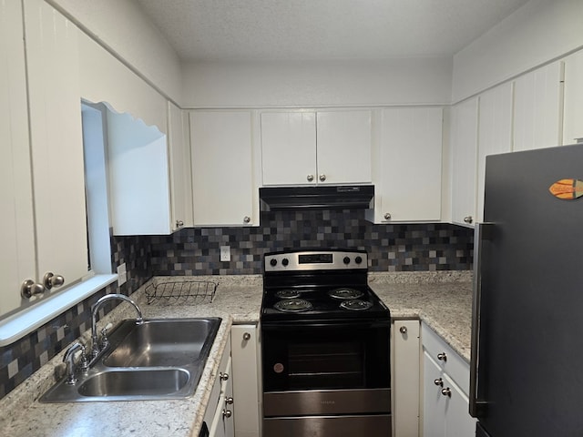 kitchen with stainless steel electric range, black refrigerator, white cabinetry, and sink