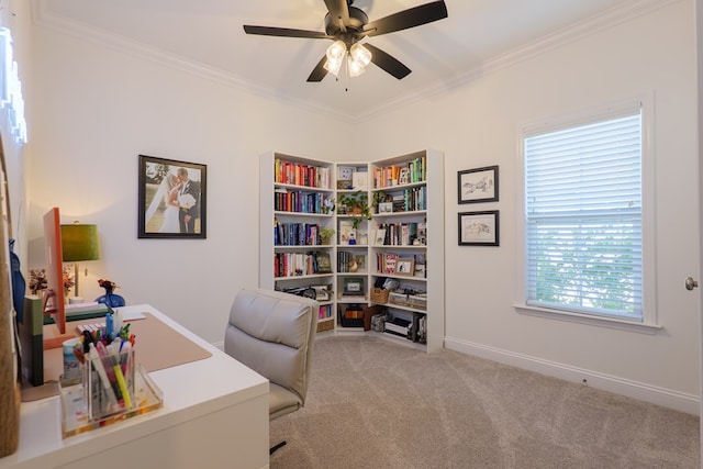 home office featuring ceiling fan, ornamental molding, baseboards, and light colored carpet