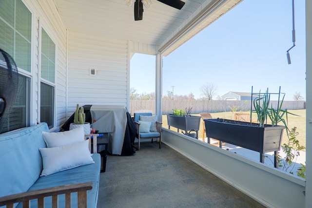 view of patio / terrace featuring grilling area, fence, and a ceiling fan