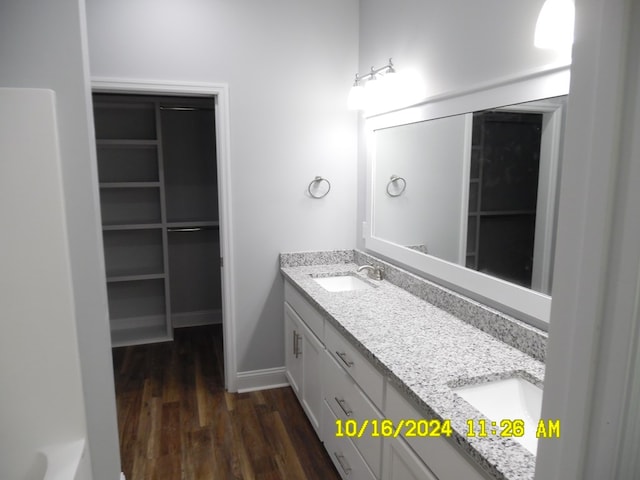 bathroom featuring vanity and hardwood / wood-style flooring