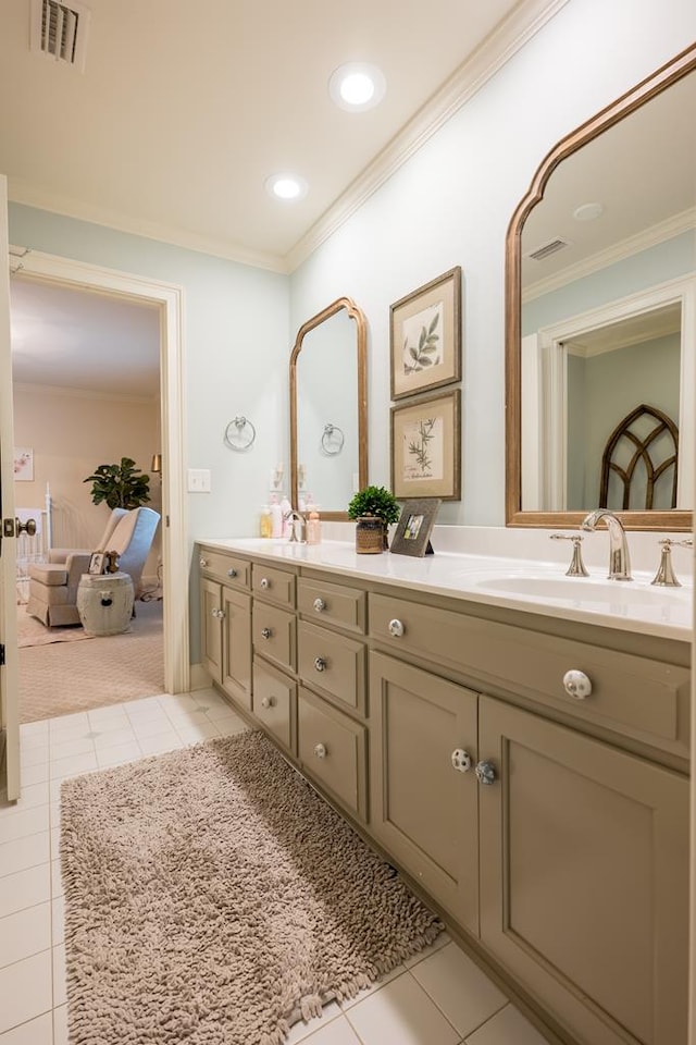793 Lake Laurie Dr, Valdosta, GA 31605 - full bathroom with double vanity, a sink, crown molding, and visible vents