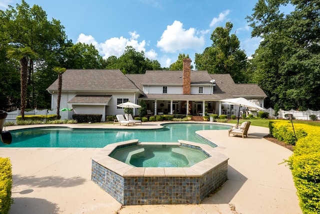 793 Lake Laurie Dr, Valdosta, GA 31605 - view of swimming pool featuring fence, a pool with connected hot tub, and a patio