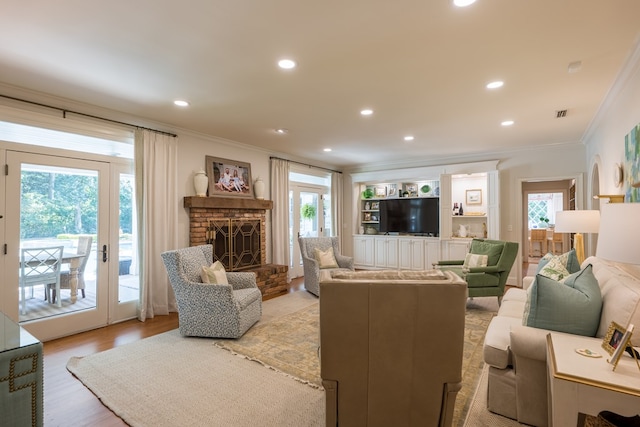793 Lake Laurie Dr, Valdosta, GA 31605 - living area with a fireplace, ornamental molding, and plenty of natural light