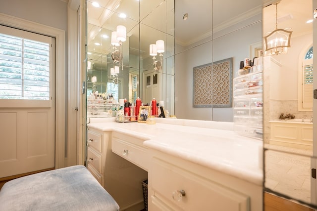 793 Lake Laurie Dr, Valdosta, GA 31605 - bathroom featuring vanity, ornamental molding, and a chandelier