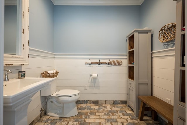 793 Lake Laurie Dr, Valdosta, GA 31605 - bathroom featuring brick floor, toilet, and a sink