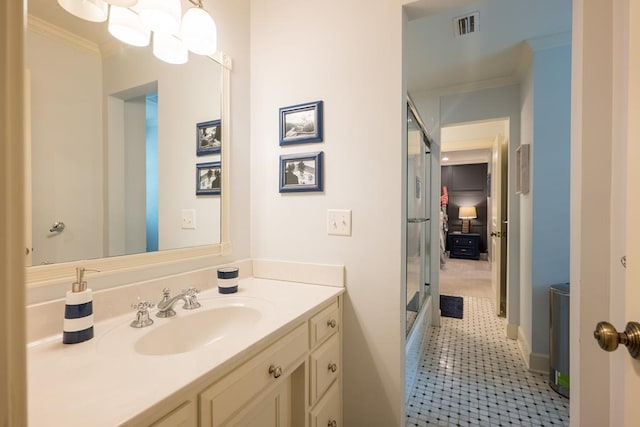 793 Lake Laurie Dr, Valdosta, GA 31605 - full bathroom featuring vanity, visible vents, a shower with door, and crown molding