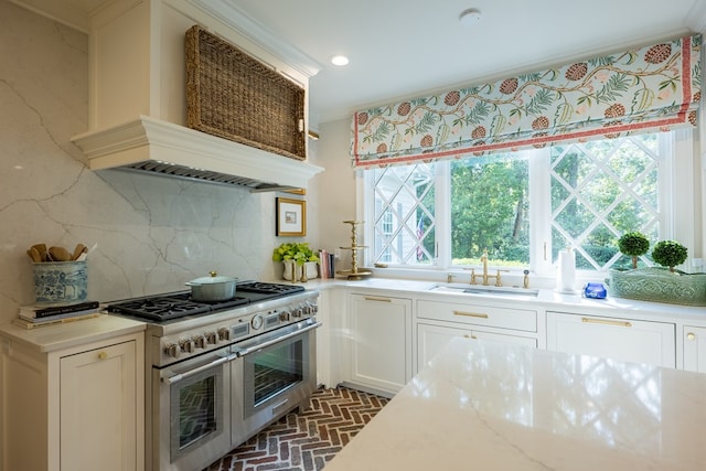 793 Lake Laurie Dr, Valdosta, GA 31605 - kitchen featuring brick floor, a sink, custom range hood, double oven range, and backsplash