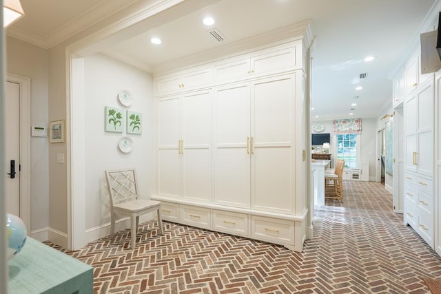 793 Lake Laurie Dr, Valdosta, GA 31605 - mudroom featuring brick floor, visible vents, recessed lighting, and ornamental molding