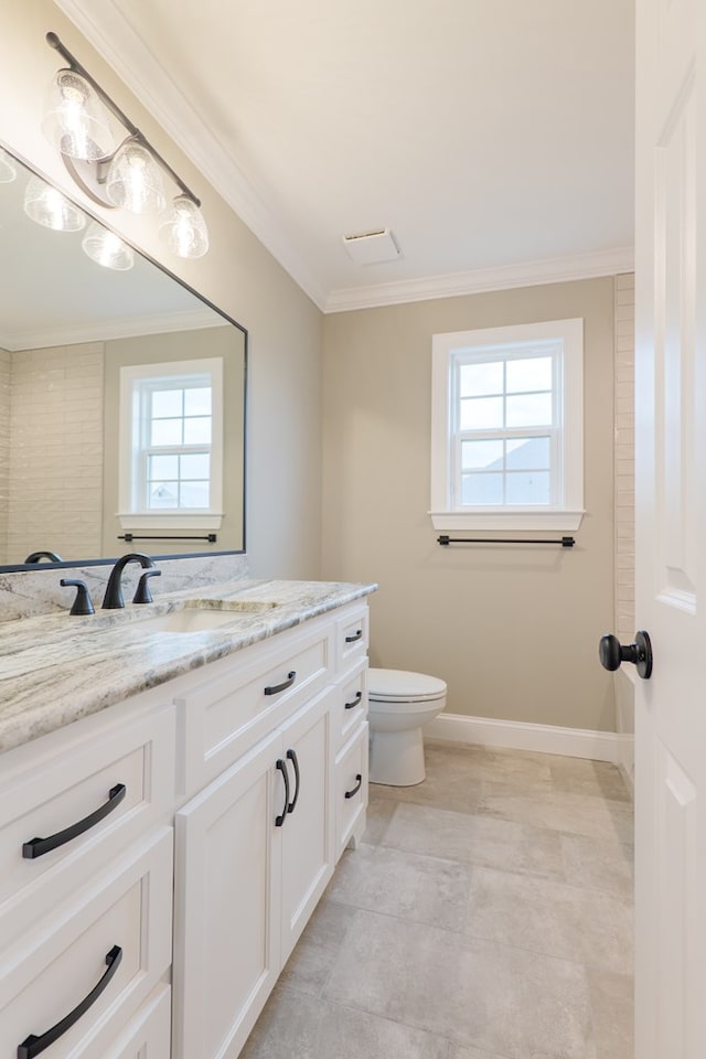 144 Audrey Ln, Hahira, GA 31632 - bathroom with plenty of natural light, crown molding, toilet, vanity, and baseboards