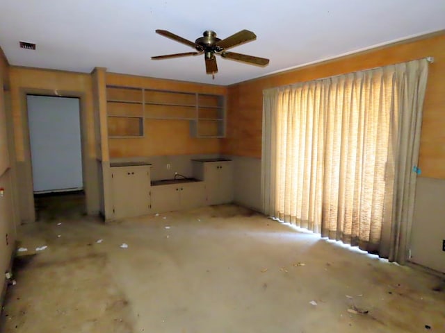 kitchen with cream cabinets and ceiling fan