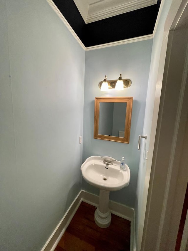 bathroom featuring baseboards and wood finished floors