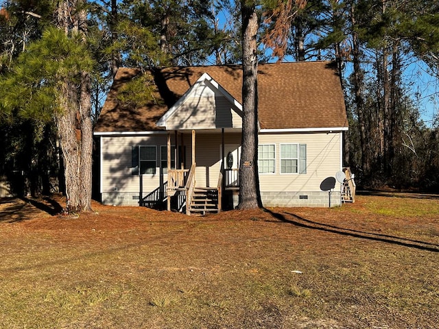 view of front of home with covered porch and a front yard