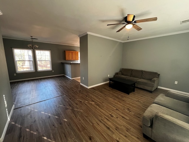 unfurnished living room featuring ceiling fan, dark hardwood / wood-style floors, and ornamental molding