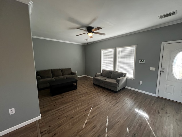 living room with ceiling fan, dark hardwood / wood-style flooring, and ornamental molding