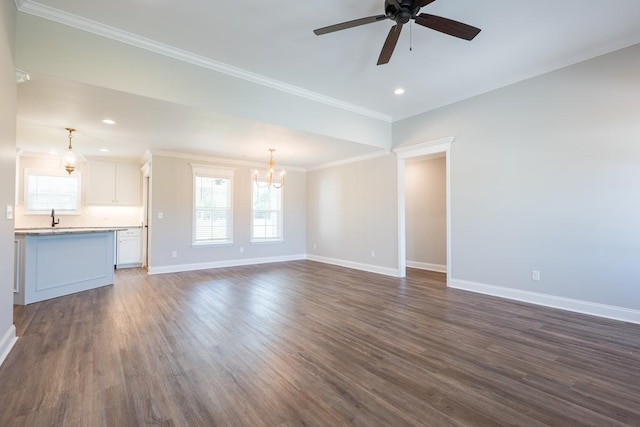 unfurnished living room with baseboards, dark wood finished floors, crown molding, and ceiling fan with notable chandelier