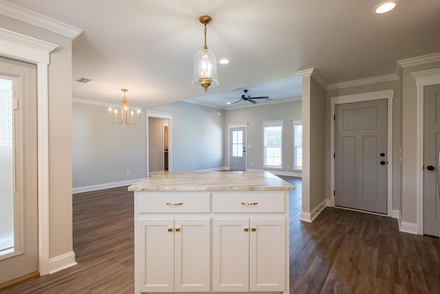 kitchen featuring visible vents, open floor plan, light stone countertops, white cabinetry, and pendant lighting