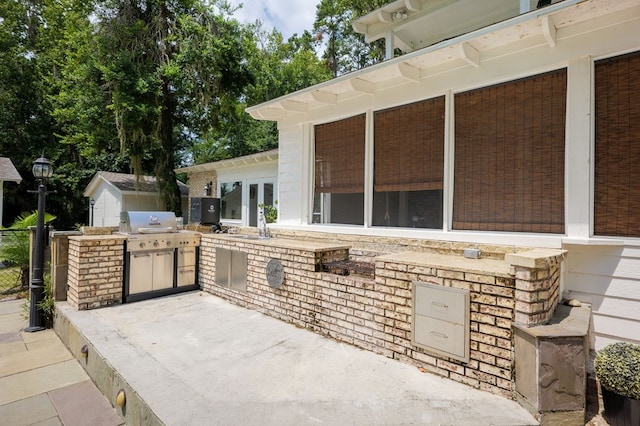 view of patio / terrace with area for grilling, grilling area, and sink