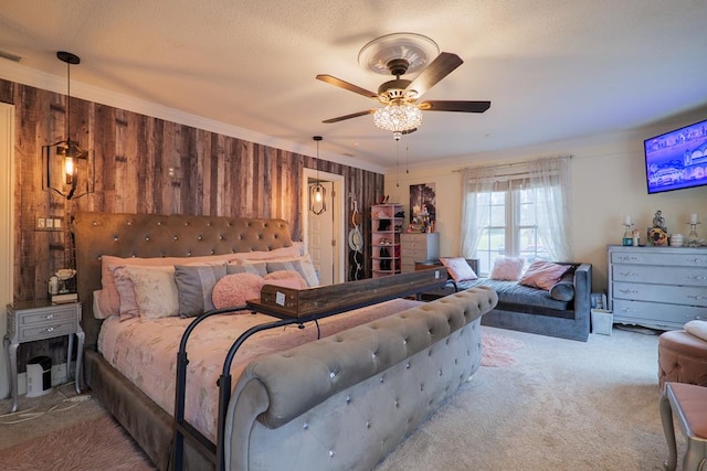 bedroom featuring ceiling fan, light colored carpet, and wooden walls