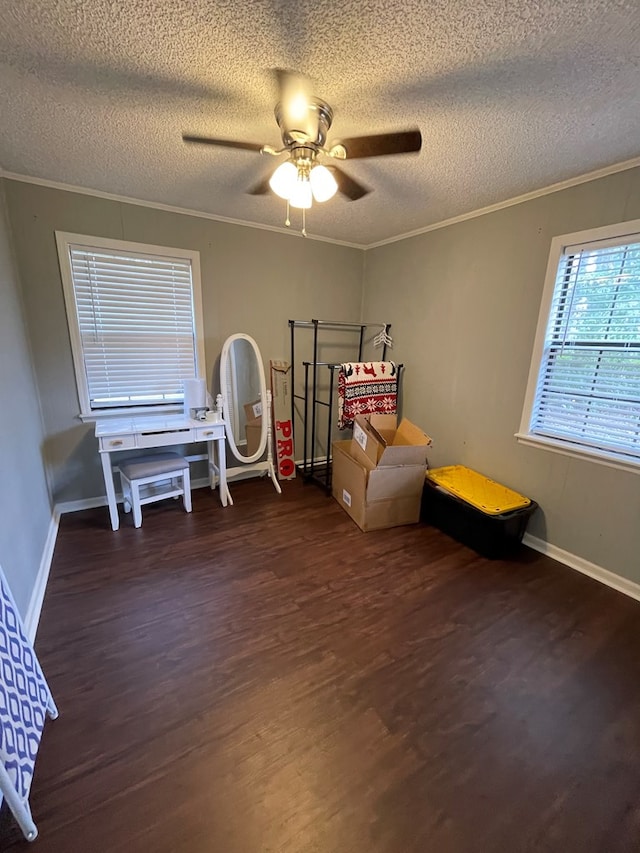bedroom featuring a textured ceiling, wood finished floors, ornamental molding, and baseboards