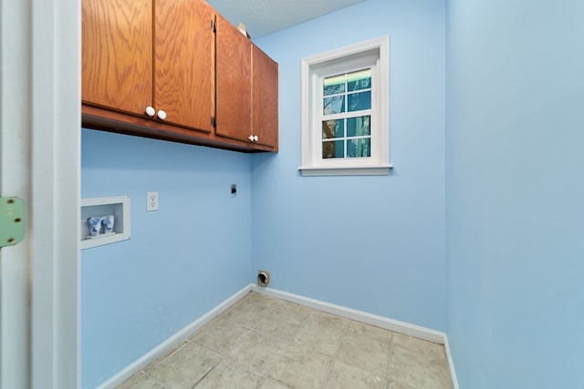 clothes washing area featuring cabinets, washer hookup, and electric dryer hookup