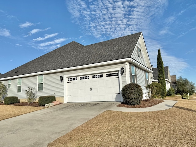 view of side of home with a garage