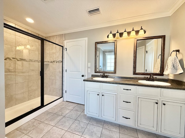 bathroom with vanity, tile patterned floors, and crown molding