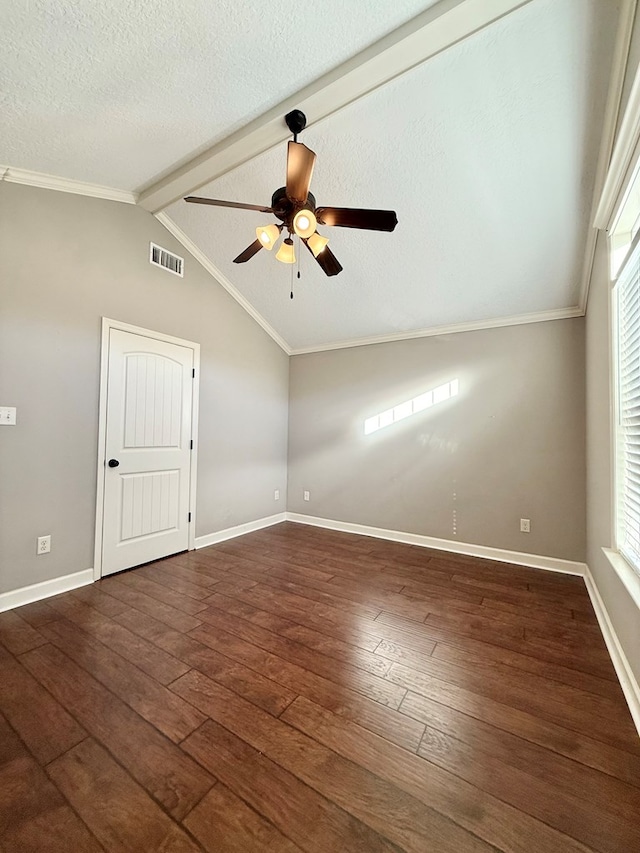 spare room with a textured ceiling, lofted ceiling with beams, ceiling fan, and dark hardwood / wood-style floors