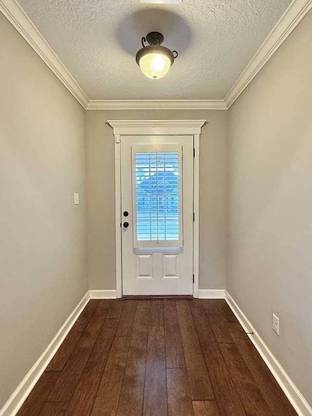 entryway with ornamental molding, a textured ceiling, and dark hardwood / wood-style floors