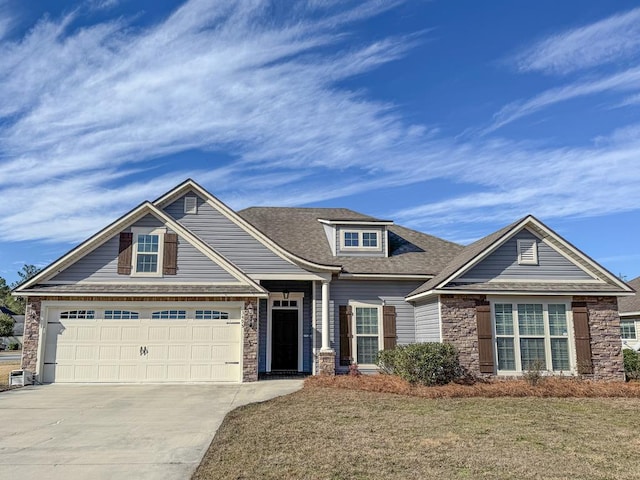 craftsman-style house with a front lawn